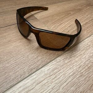 Oakley Brown Wraparound Glasses with Sporty Design